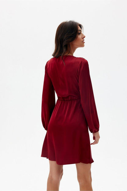 Satin cocktail dress with waist tie, long sleeves, back view, deep red above-knee