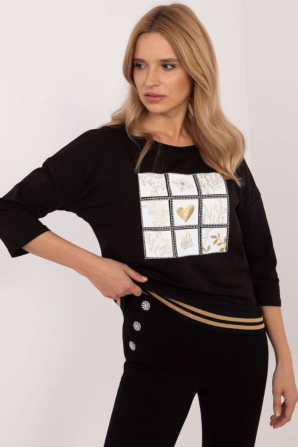 Black blouse with square sequin print panel, 3/4 sleeves, and striped hem band