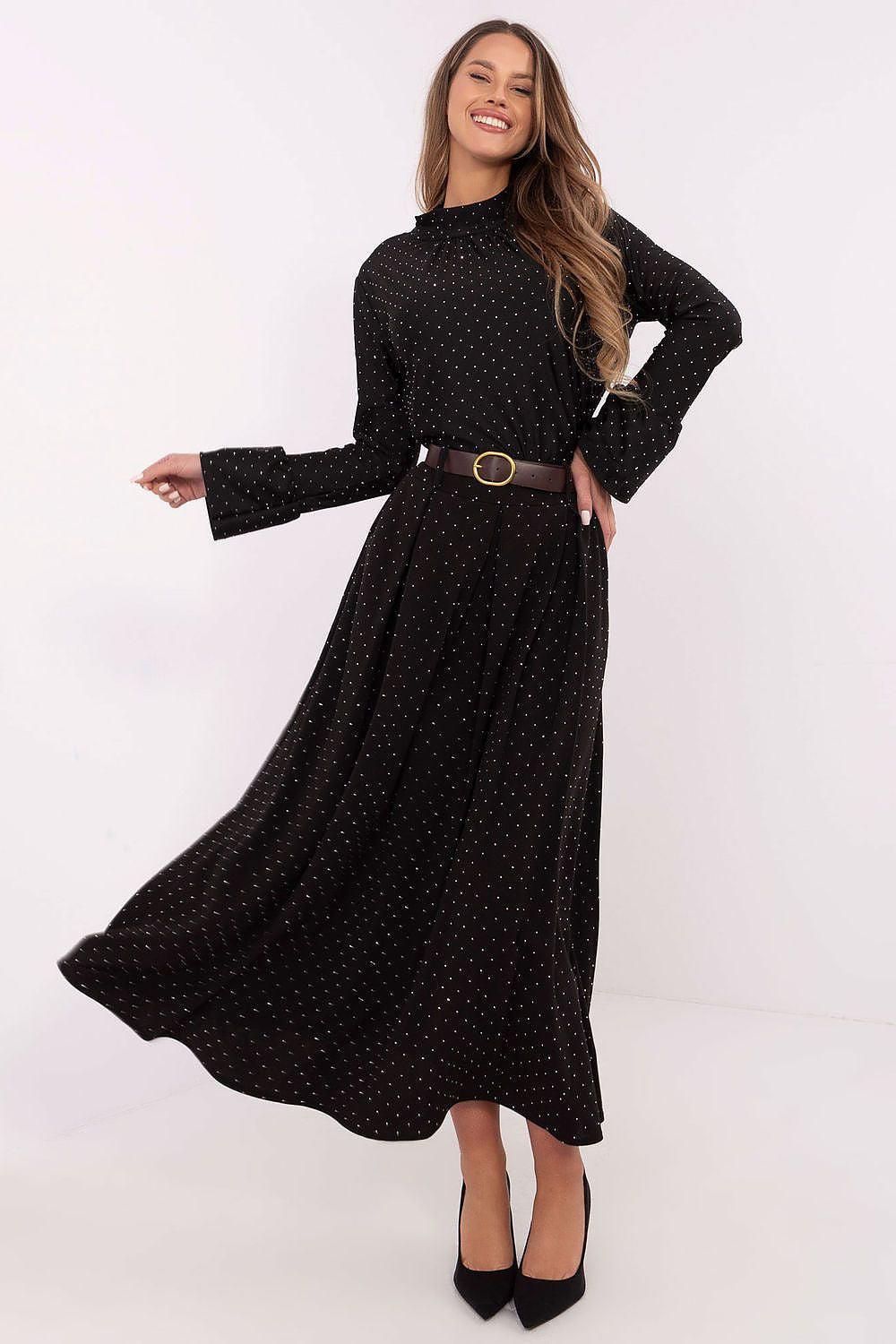 Black long A-line skirt with small dotted pattern and brown belt, midi length