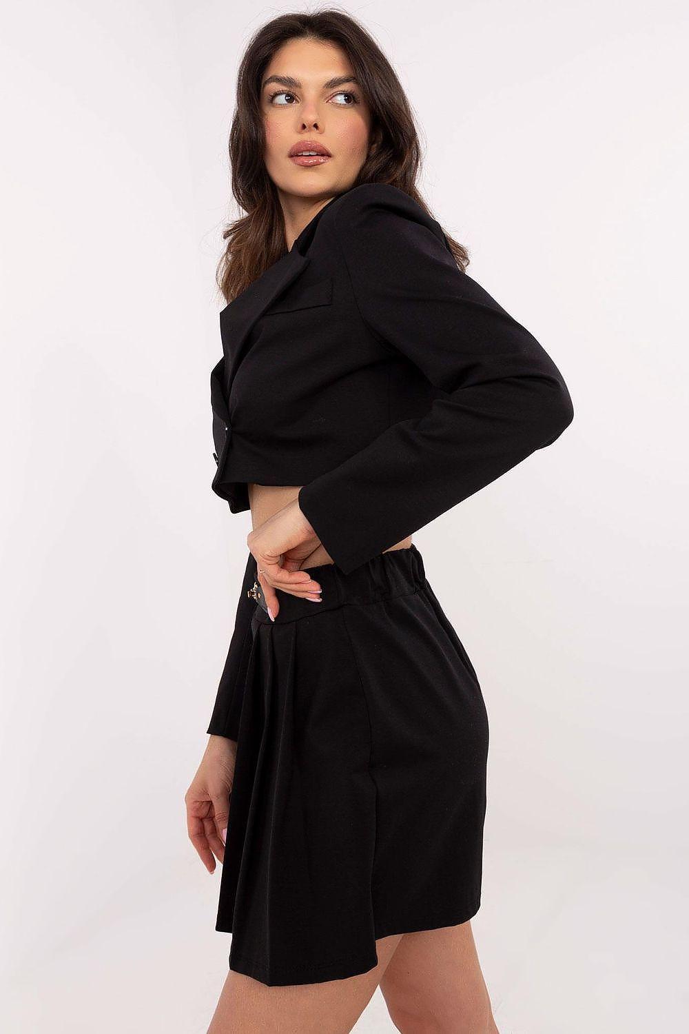 Black pleated skort with high waist and belt, side view