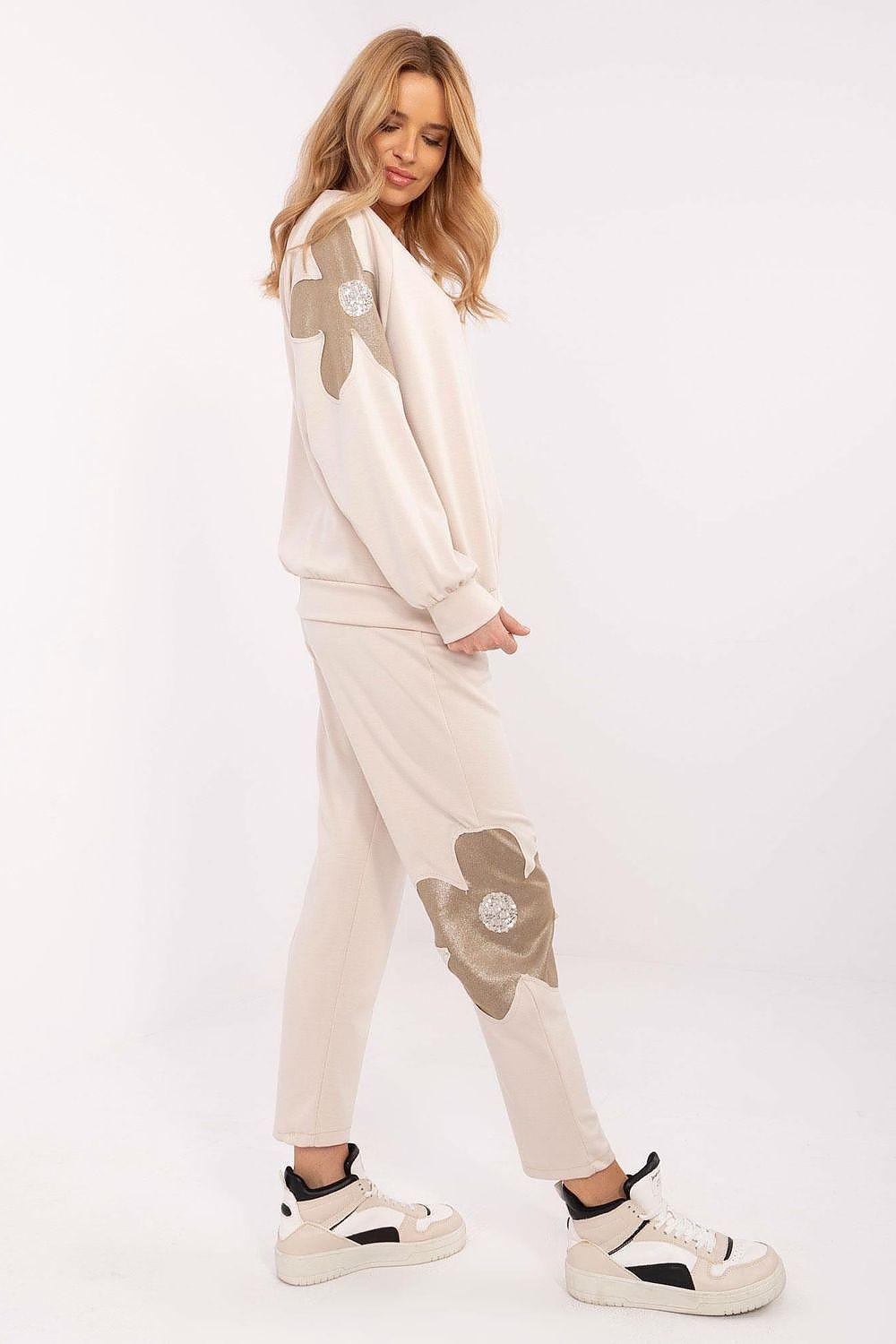 Beige floral embellished tracksuit set with matching sweatshirt and jogger pants