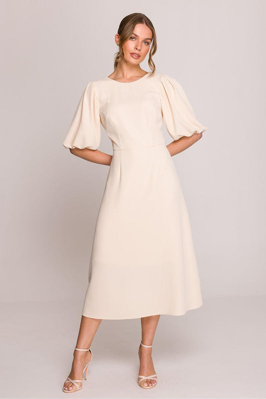 Beige midi daydress with short puff sleeves, fitted bodice, and flared skirt