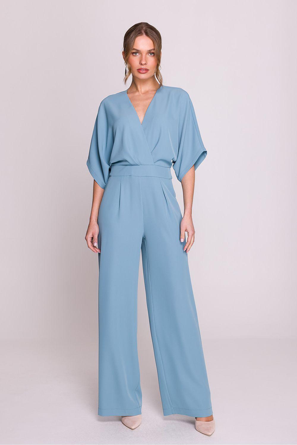 Light blue wide-leg jumpsuit with V-neck, belted waist, and loose kimono sleeves.