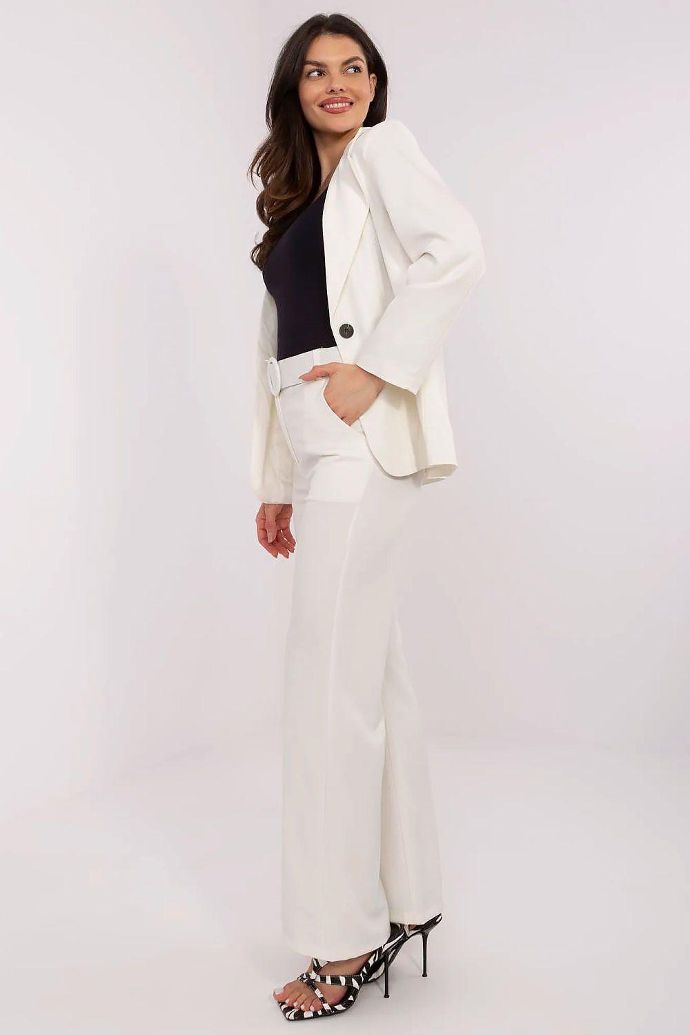 White tailored trousers with round-buckle waist belt and straight wide-leg fit