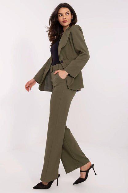 Olive green tailored trousers with round-buckle waist belt and straight wide legs