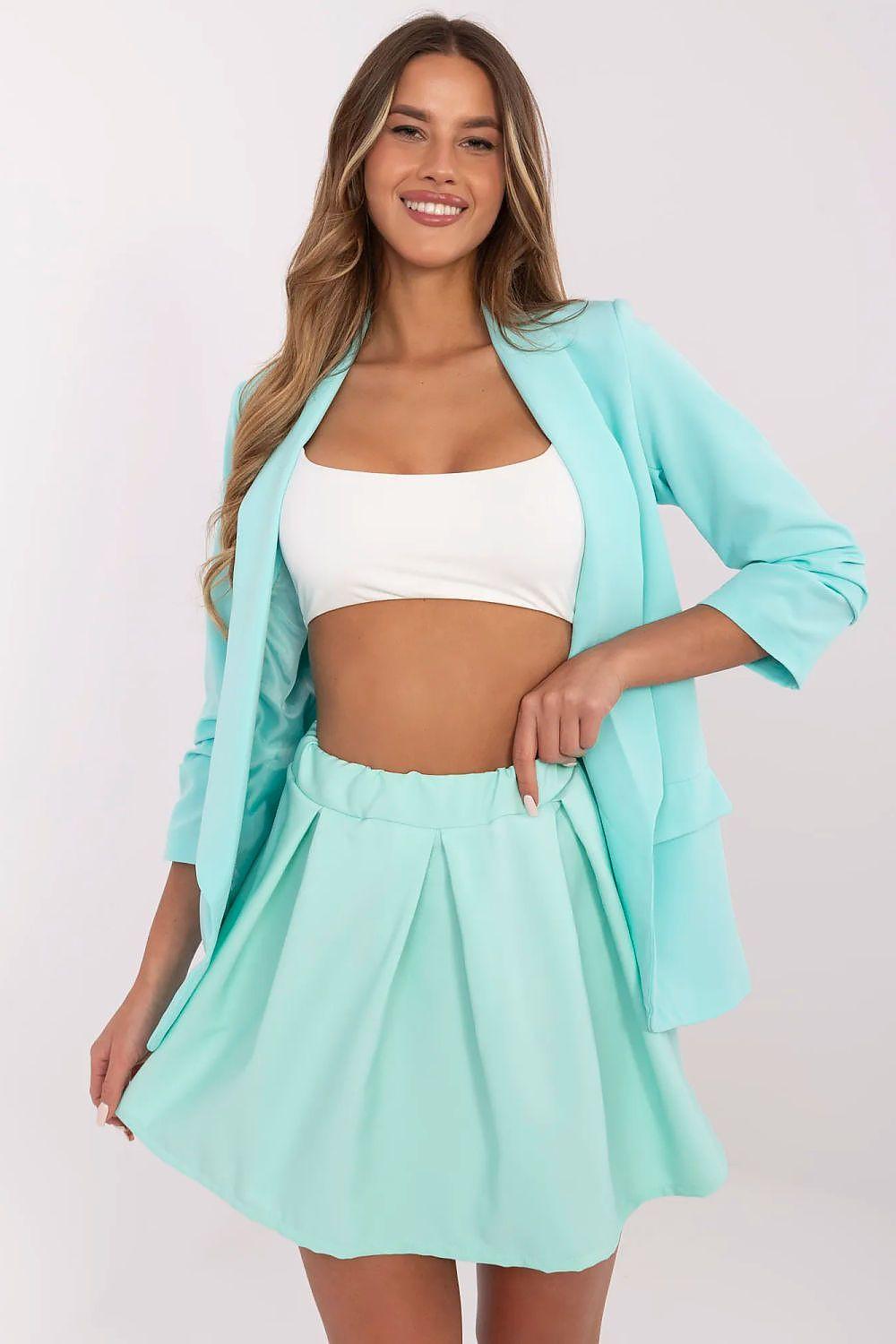 Teal pleated mini skirt with built-in shorts, elastic waist.