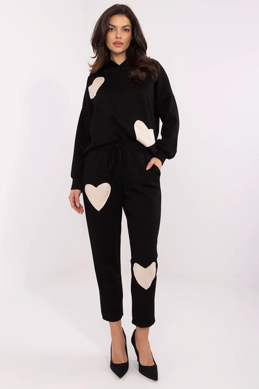 Black two-piece lounge set, heart patches on hoodie and jogger pants