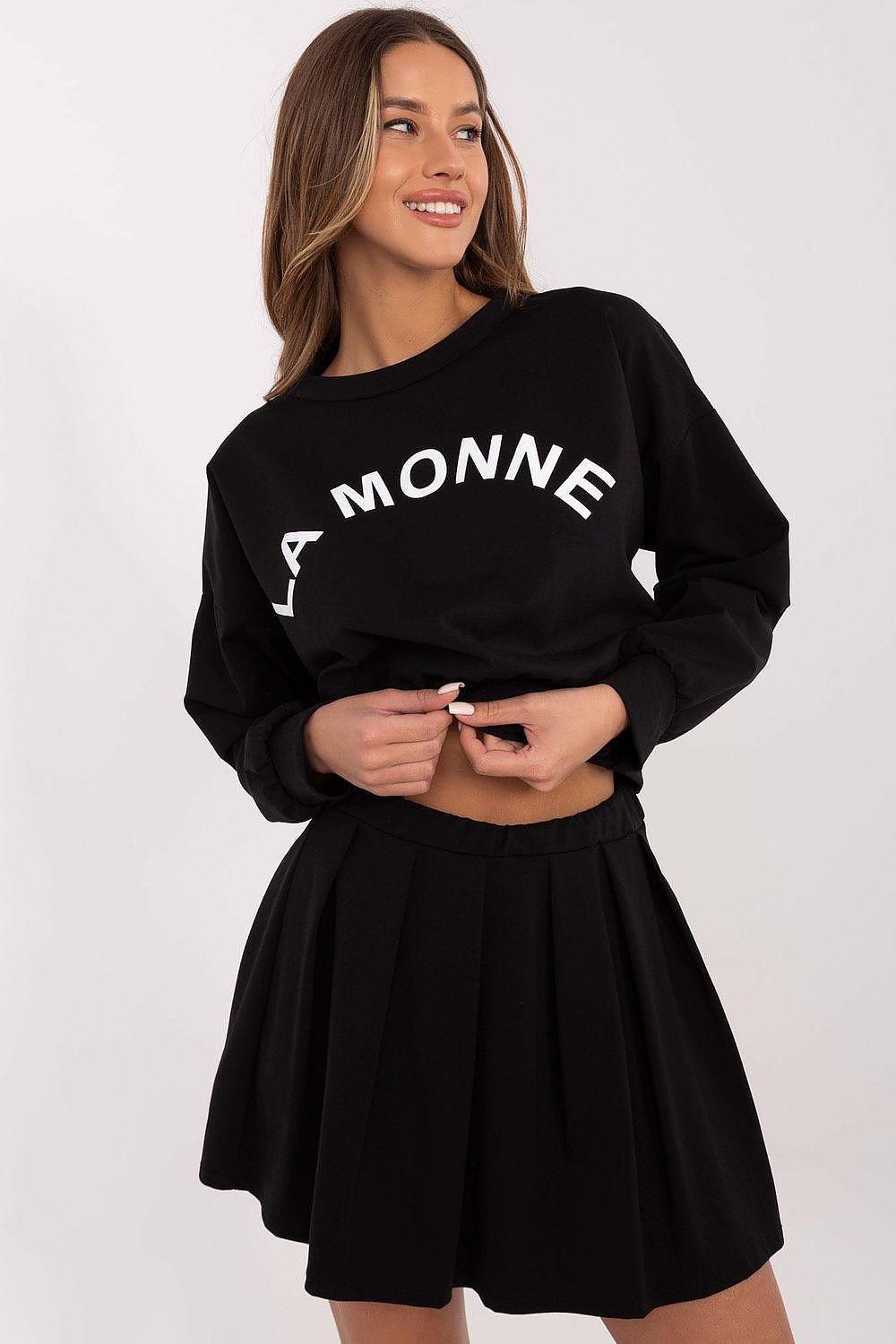 Black sweatshirt and pleated skirt set with cropped hem and bold front logo