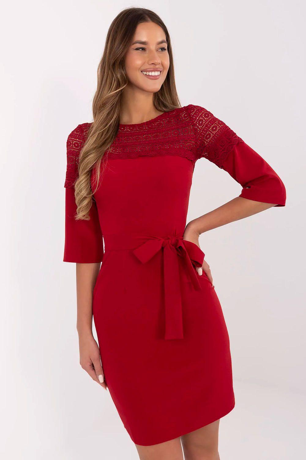 Red cocktail dress with lace yoke, 3/4 sleeves, and waist tie bow