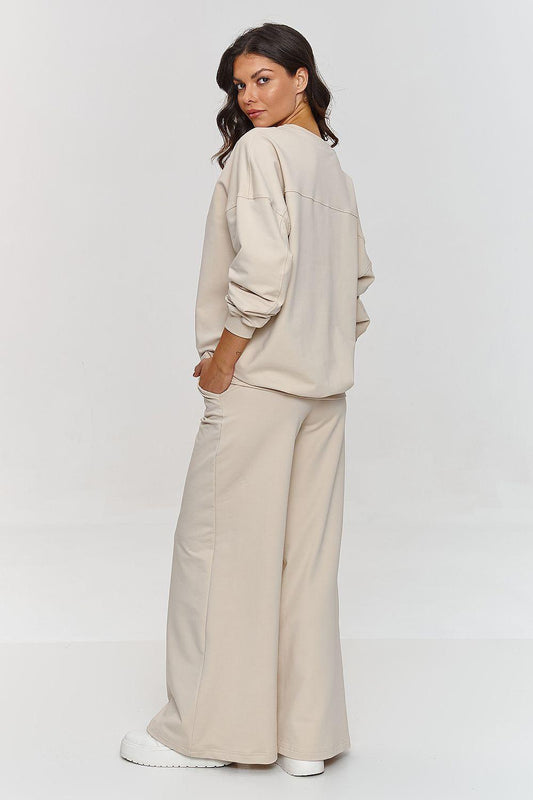 Beige 2-piece lounge set with relaxed sweatshirt and wide-leg pants, side view