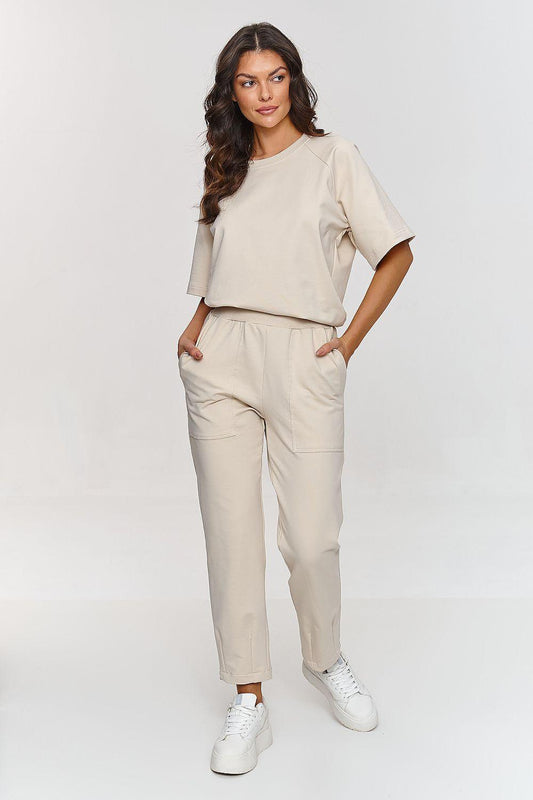 Beige two-piece lounge set with short-sleeve tee and tapered jogger pants, crew neck