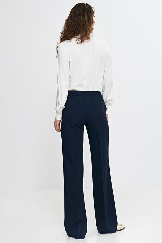 White button-up shirt, back view with long sleeves and tie-neck detail