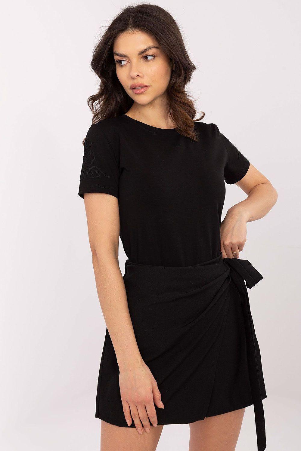 Black T-shirt with crew neck and short sleeves, worn with a tied wrap skirt
