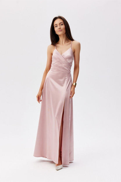 Pink long evening dress with spaghetti straps, ruched bodice, and side slit.