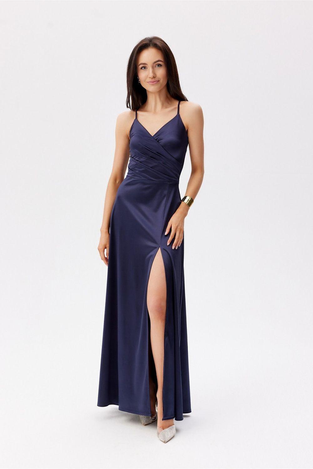 Navy long evening dress with spaghetti straps, ruched bodice, and side slit.