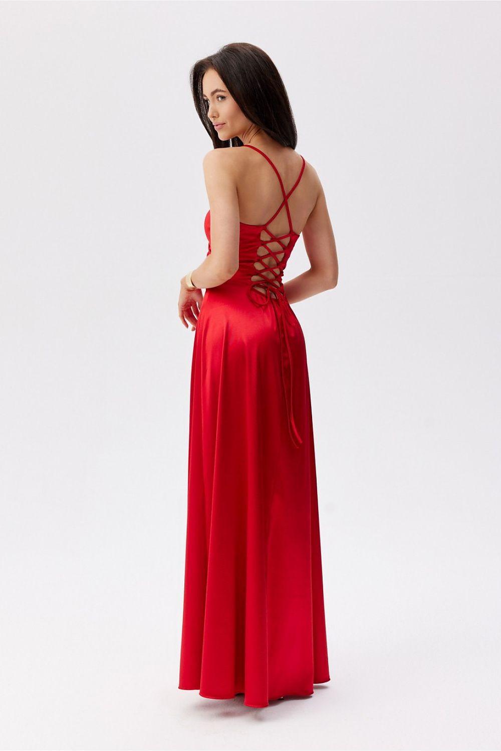 Red backless long dress with crisscross open-back straps and lace-up detail.