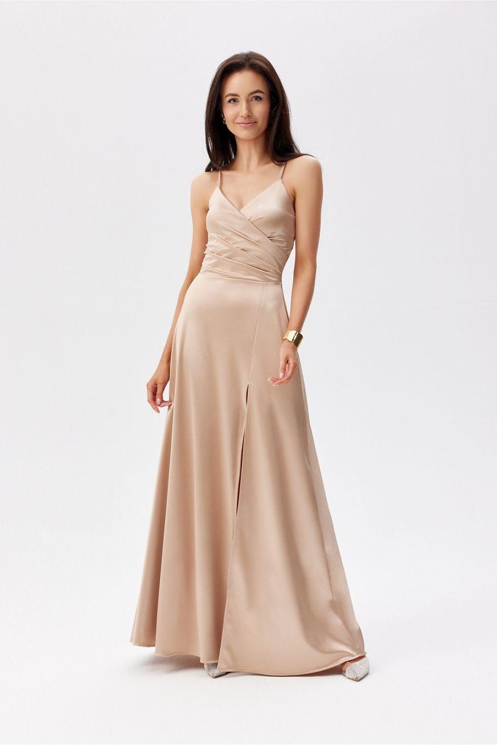 Beige long dress with spaghetti straps, ruched bodice, and side slit
