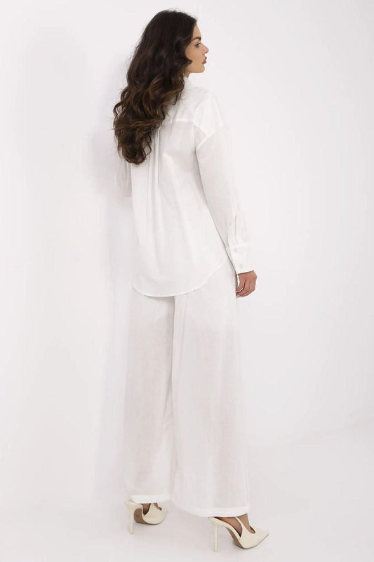 Light-colored two-piece set, side view: button-up shirt with wide-leg pants