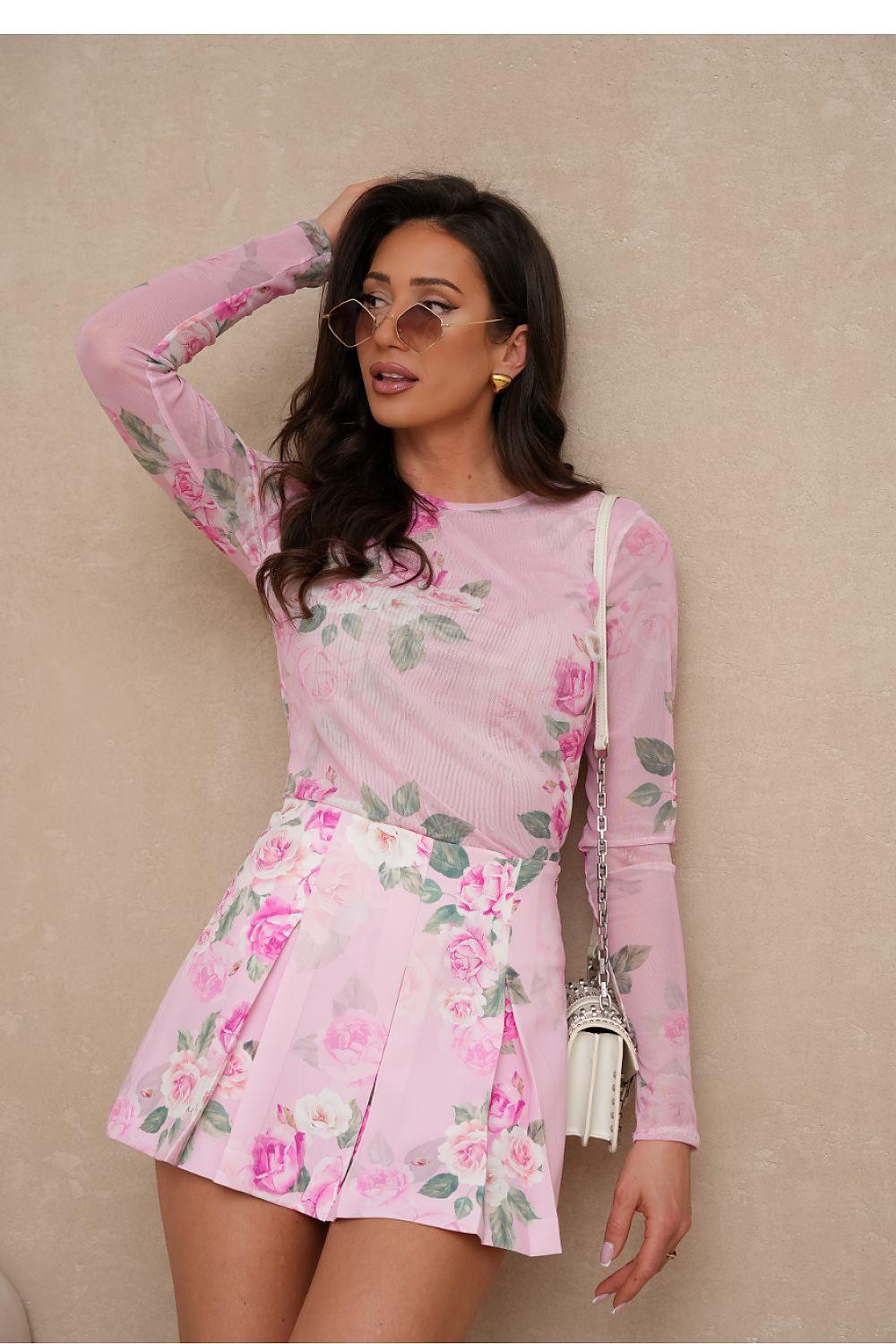 Pink floral long-sleeve mini dress with fitted waist and pleated skirt