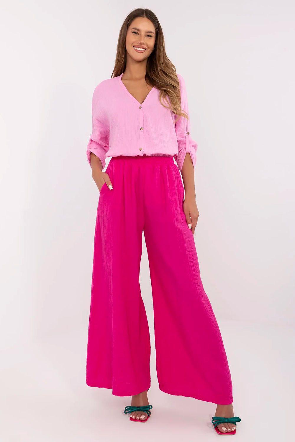 Women’s pink wide-leg trousers with elastic waistband and long, flowy legs