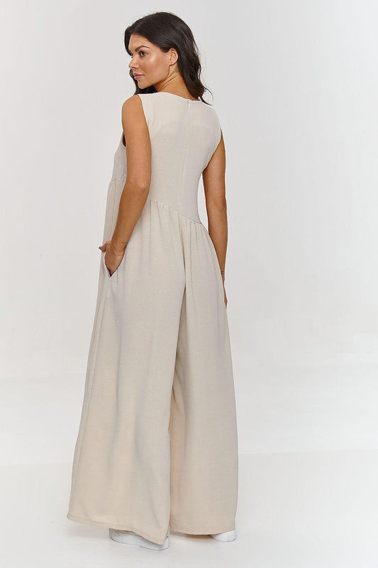Beige sleeveless maxi dress with scoop back, gathered waist, and side pockets