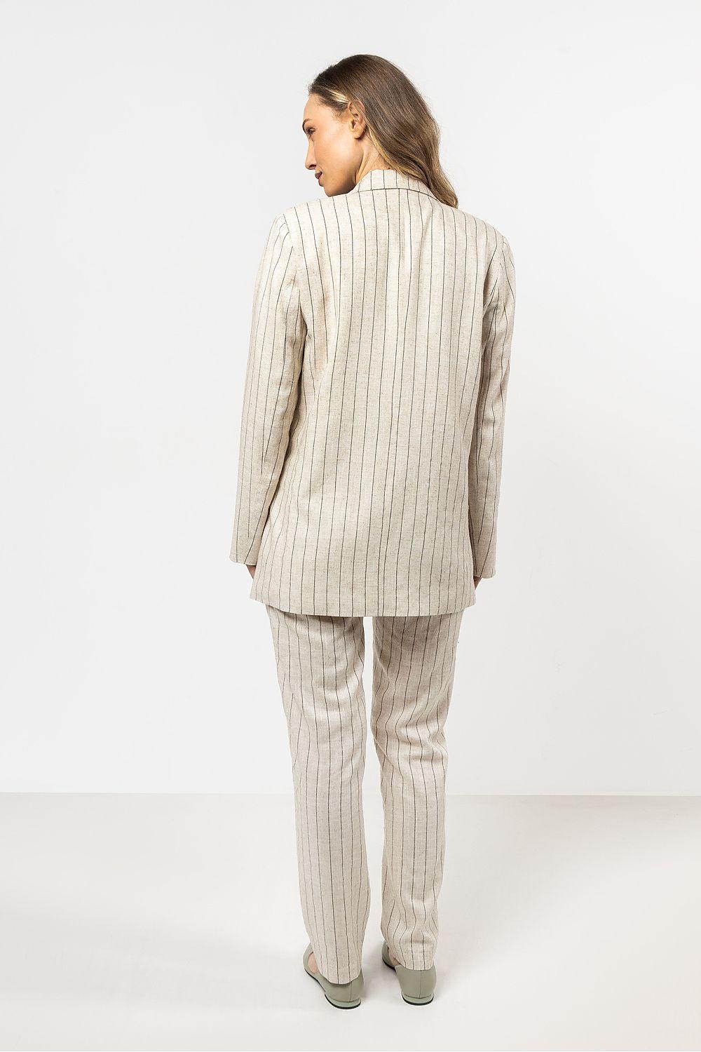Women’s beige pinstripe trousers, rear view with tapered legs and ankle hem