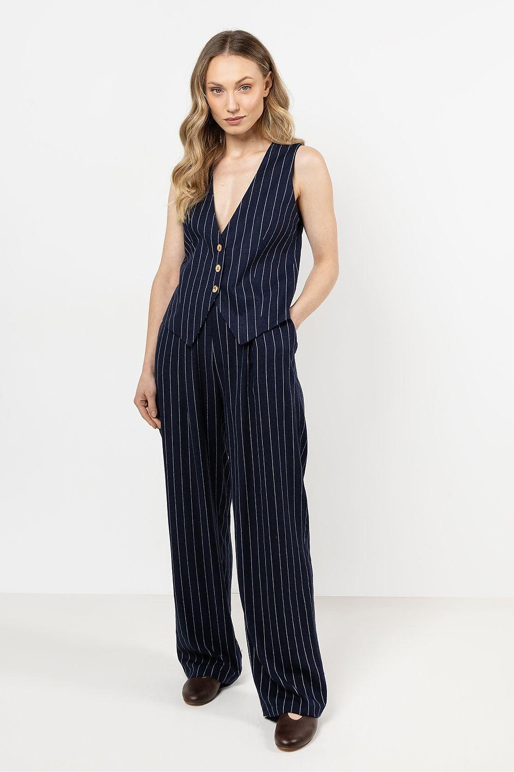 Navy pinstriped wide-leg trousers with pleated front and side pockets