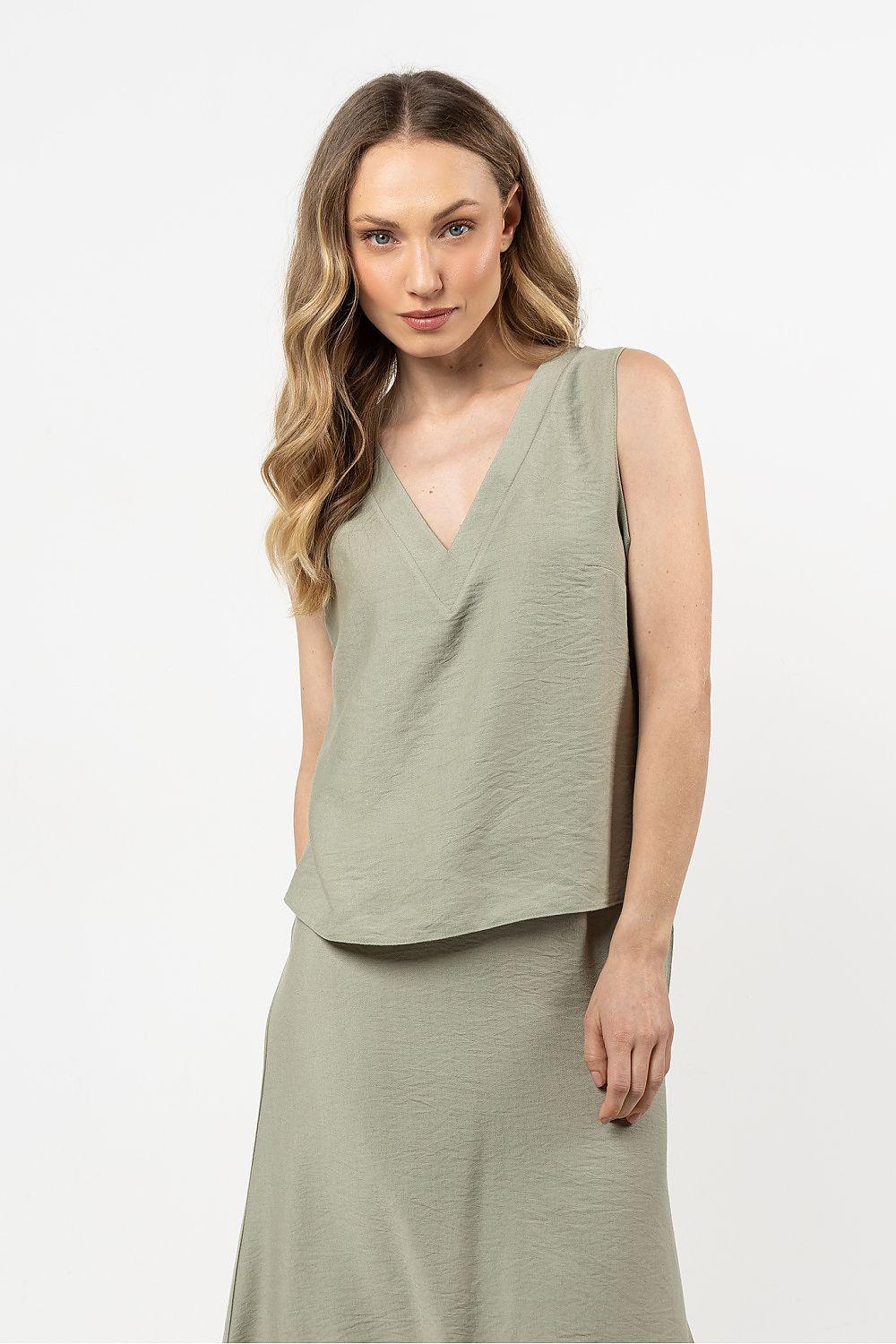 Sleeveless V-neck blouse in sage green with draped crossover front and straight hem