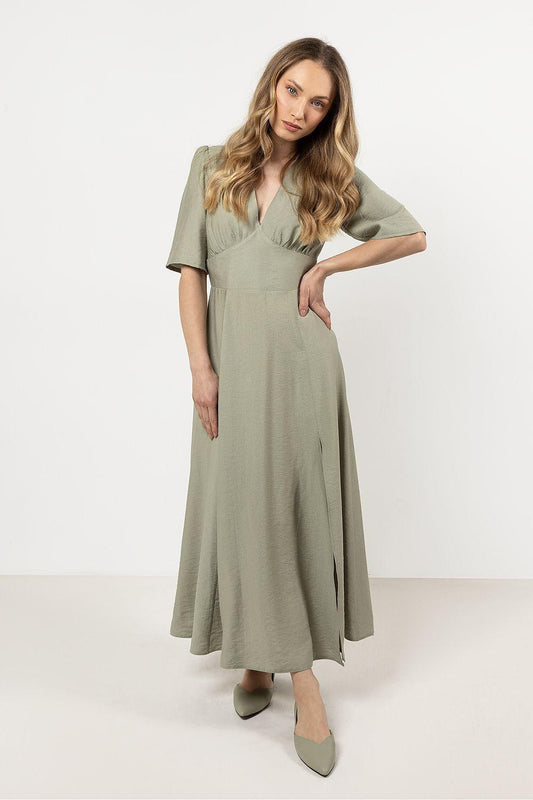 Green V-neck day dress with short sleeves and front slit, fitted waist, midi length