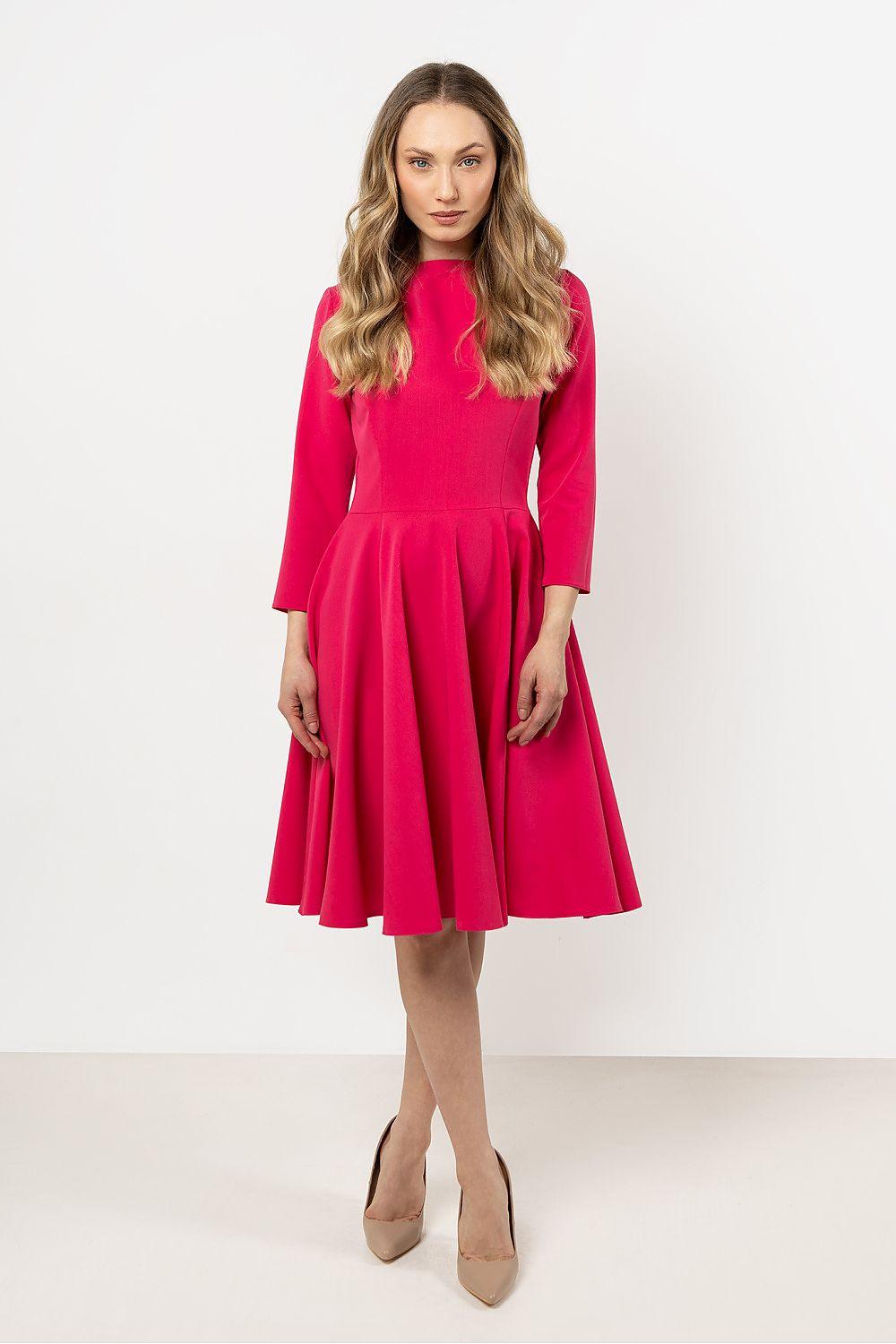 Pink daydress with 3/4 sleeves, fitted bodice, and pleated flared skirt