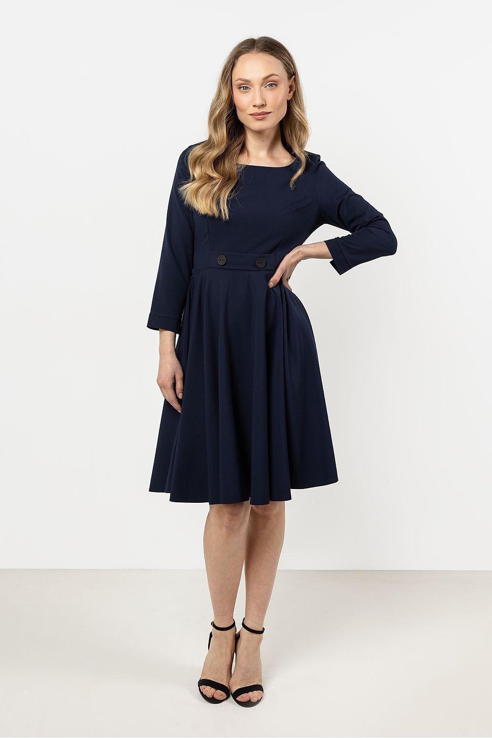 Navy blue daydress with three-quarter sleeves, button detail at waist, flared skirt