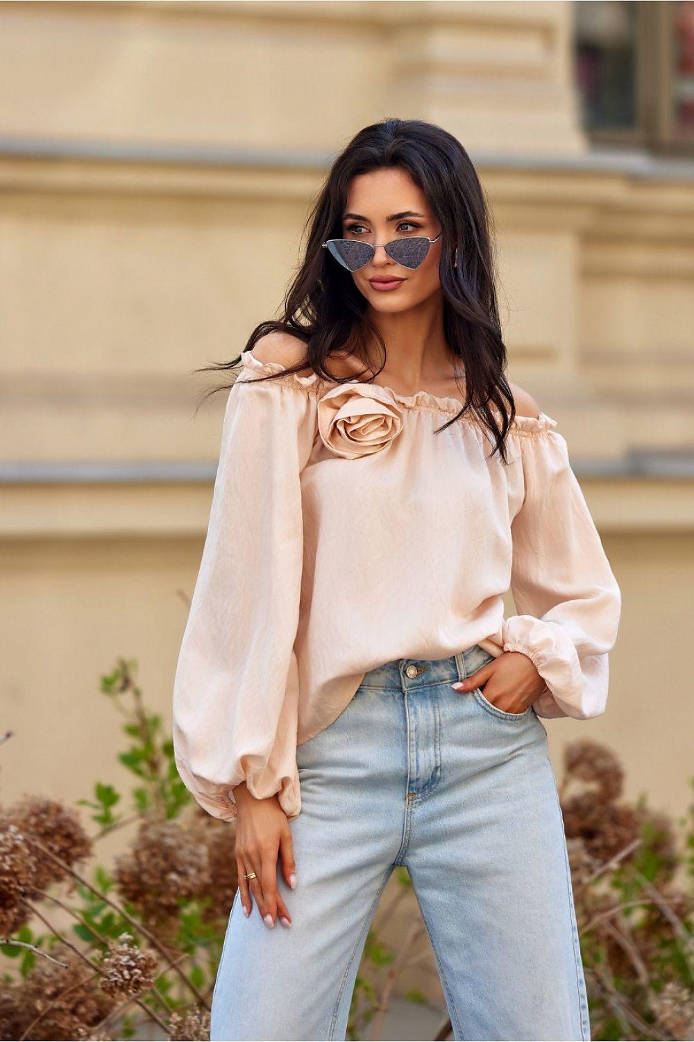 Beige off-shoulder blouse with rose applique, long puff sleeves.