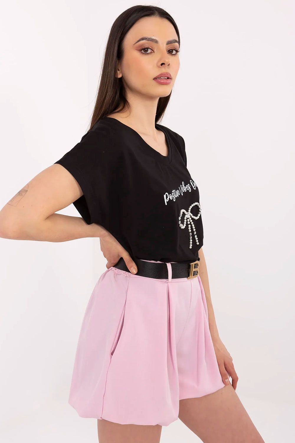Black women's V-neck T-shirt with small rhinestone bow badge