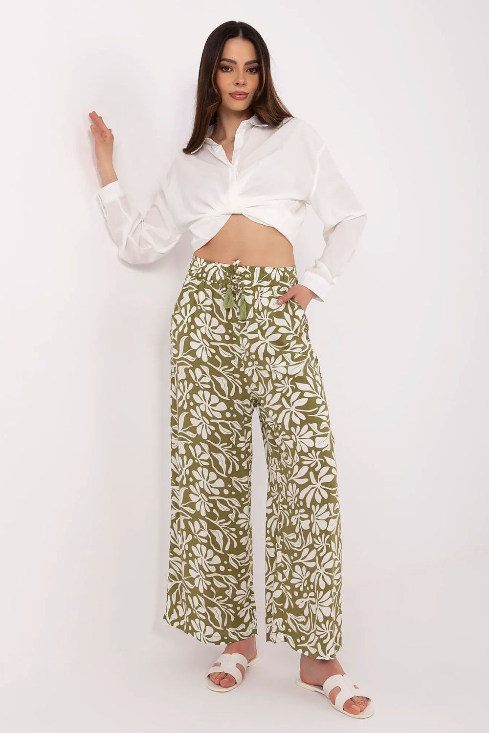 Green floral wide-leg trousers with relaxed fit and full-length straight drape
