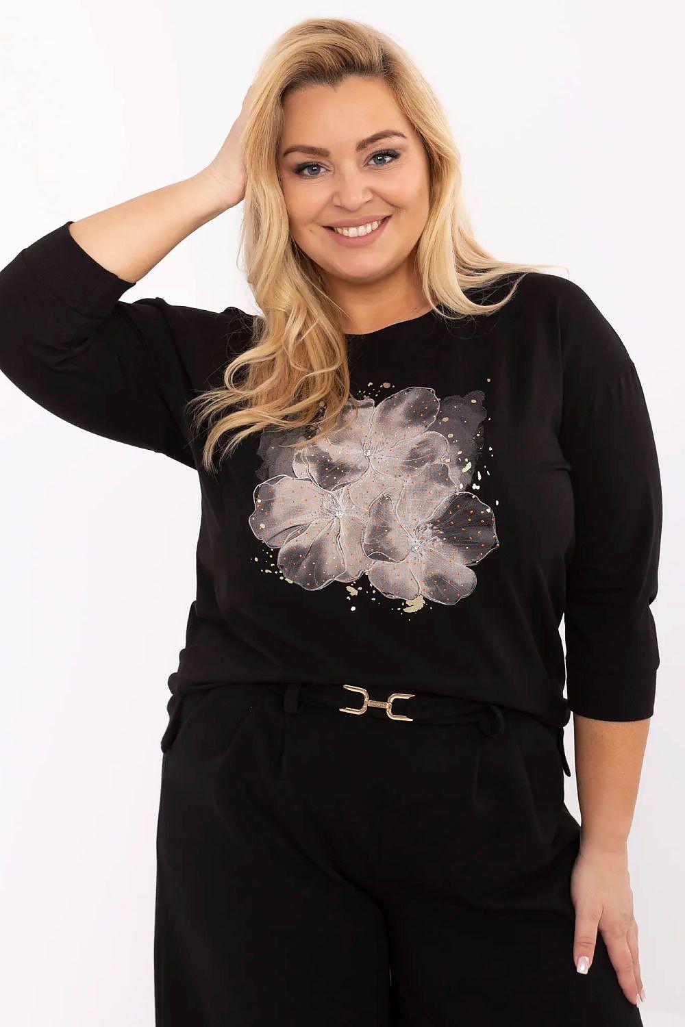 Plus size black blouse with 3/4 sleeves and large floral graphic on the front