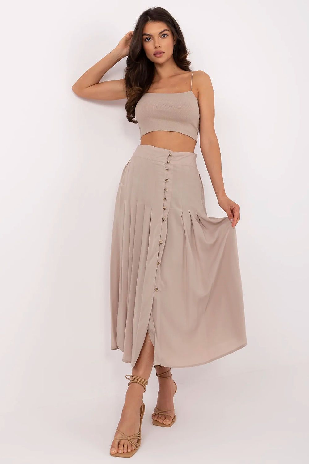Beige pleated midi skirt with front button placket and flowy A-line fit