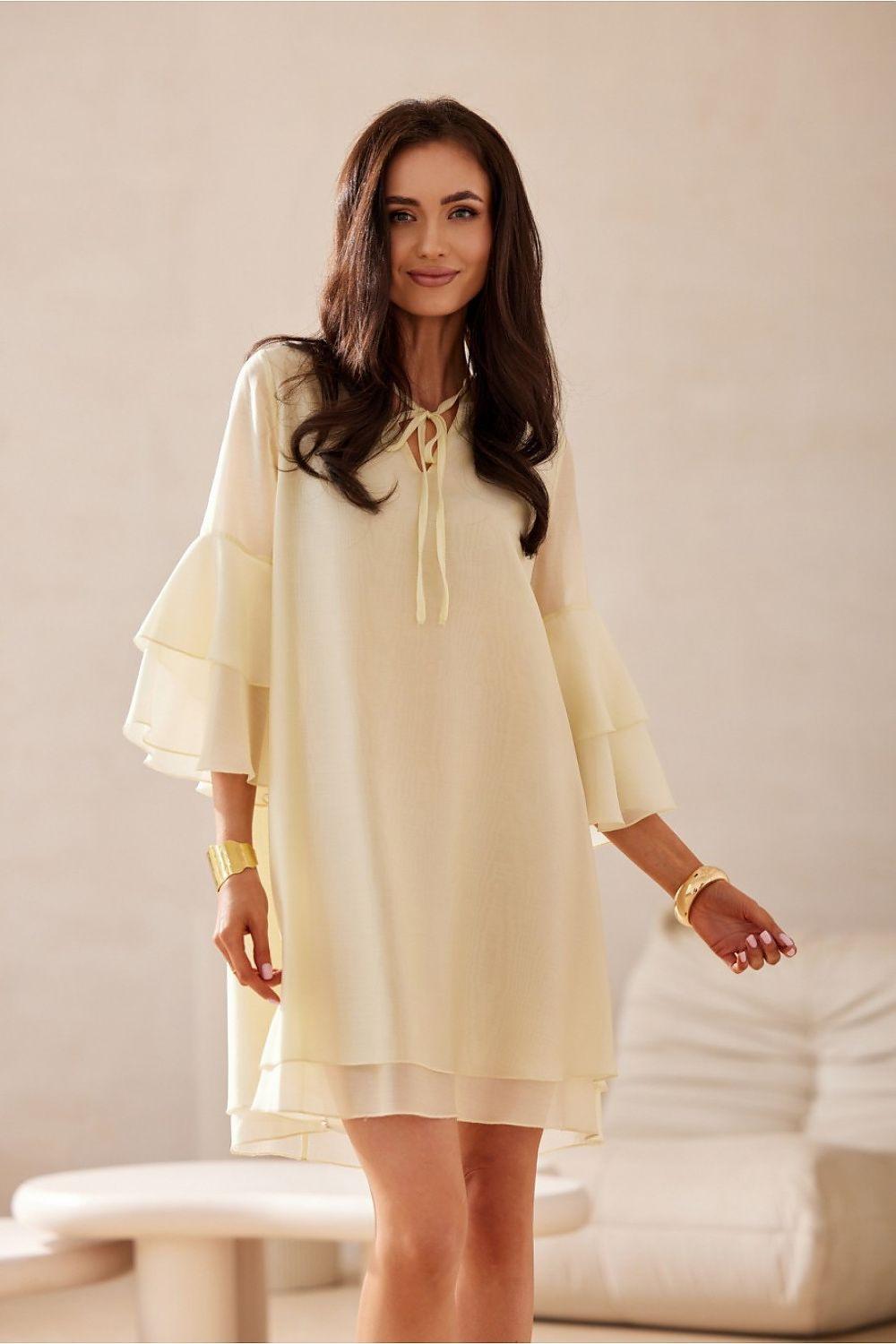 Beige cocktail dress with tied neck and tiered flounce bell sleeves