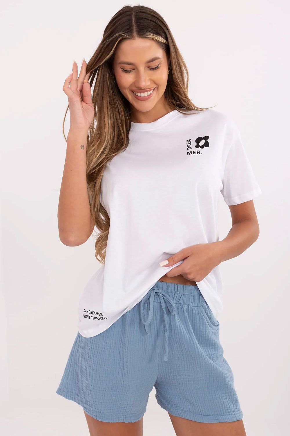 White women's cotton T-shirt with small chest graphic and crew neck