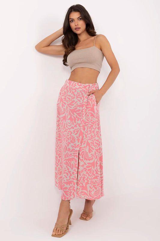 Pink midi skirt with white leaf print, front slit and elastic waist