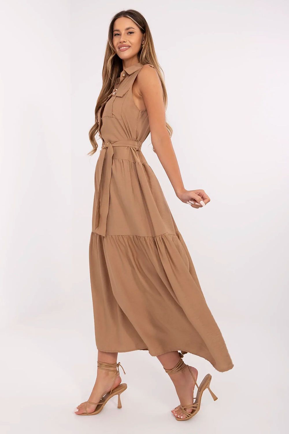 Brown sleeveless maxi dress with tie waist, button bodice, flowing tiered skirt