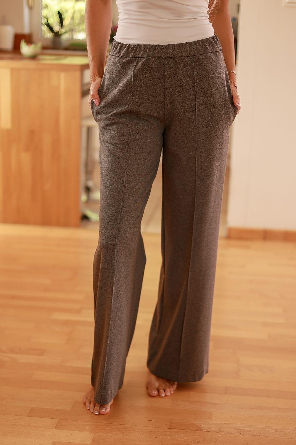 Grey high-waist wide-leg trousers with relaxed fit and textured fabric