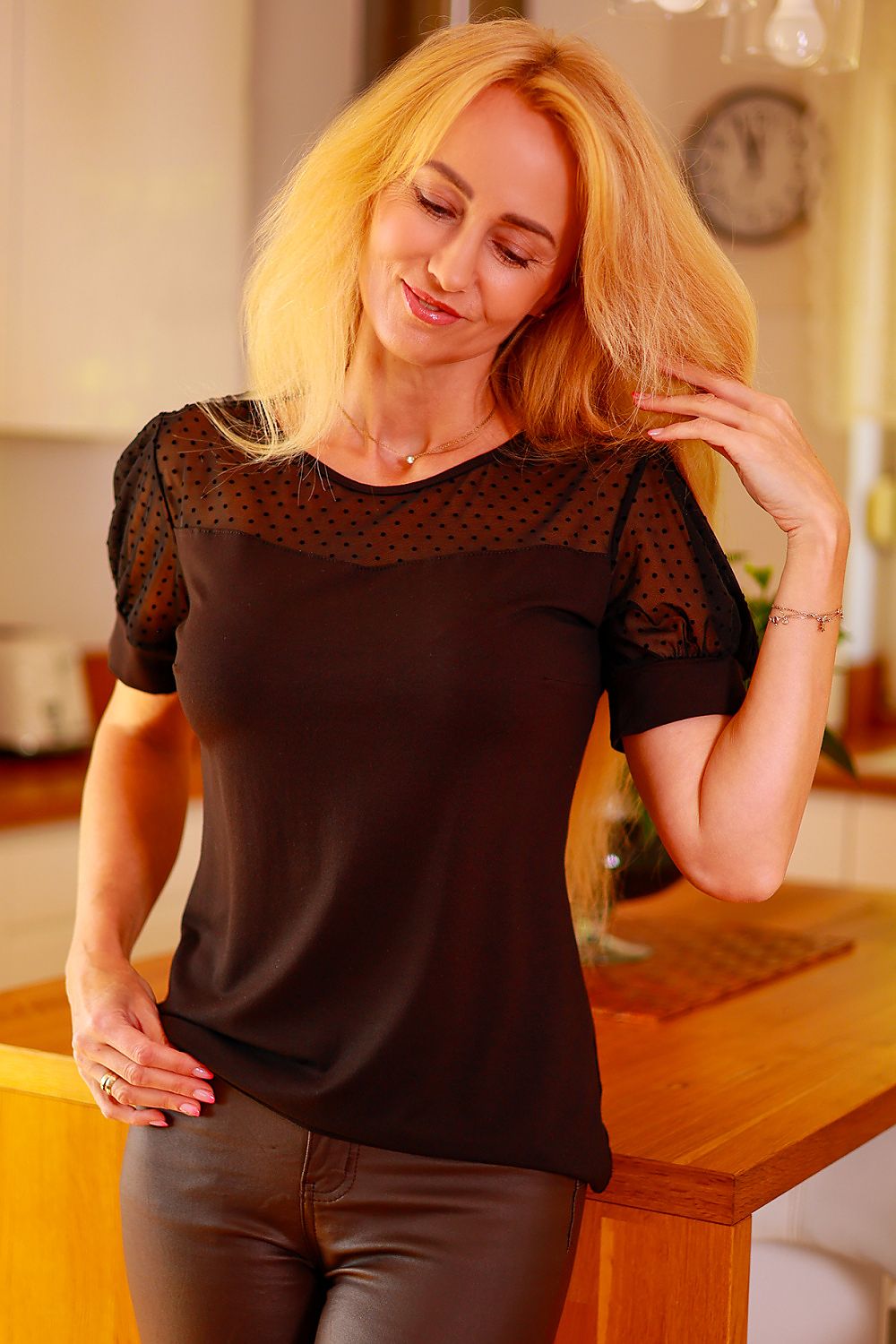 Black polka dot tulle blouse with short puff sleeves and scoop neckline
