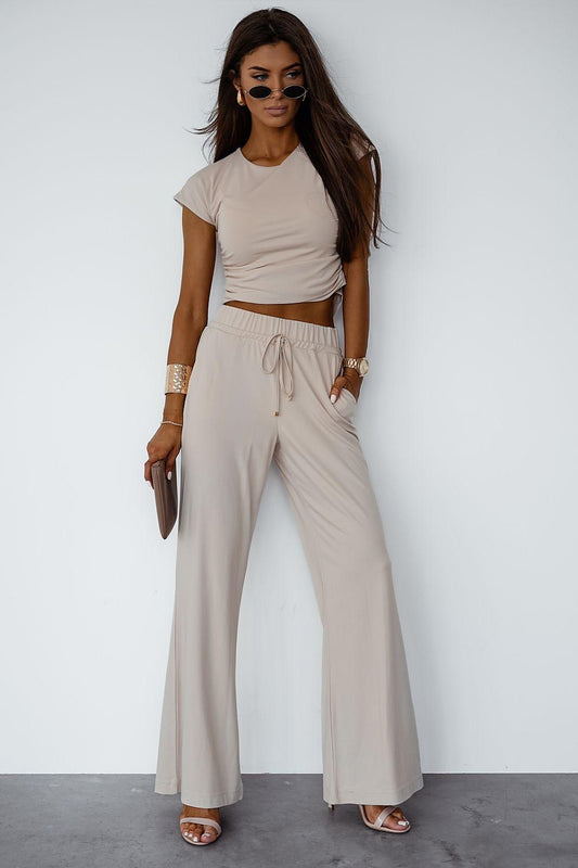 Beige two-piece set: cropped short-sleeve top and drawstring wide-leg pants