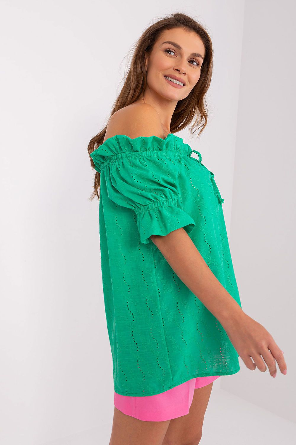 Green off-shoulder cotton blouse with fluttery sleeve ruffles and eyelet texture