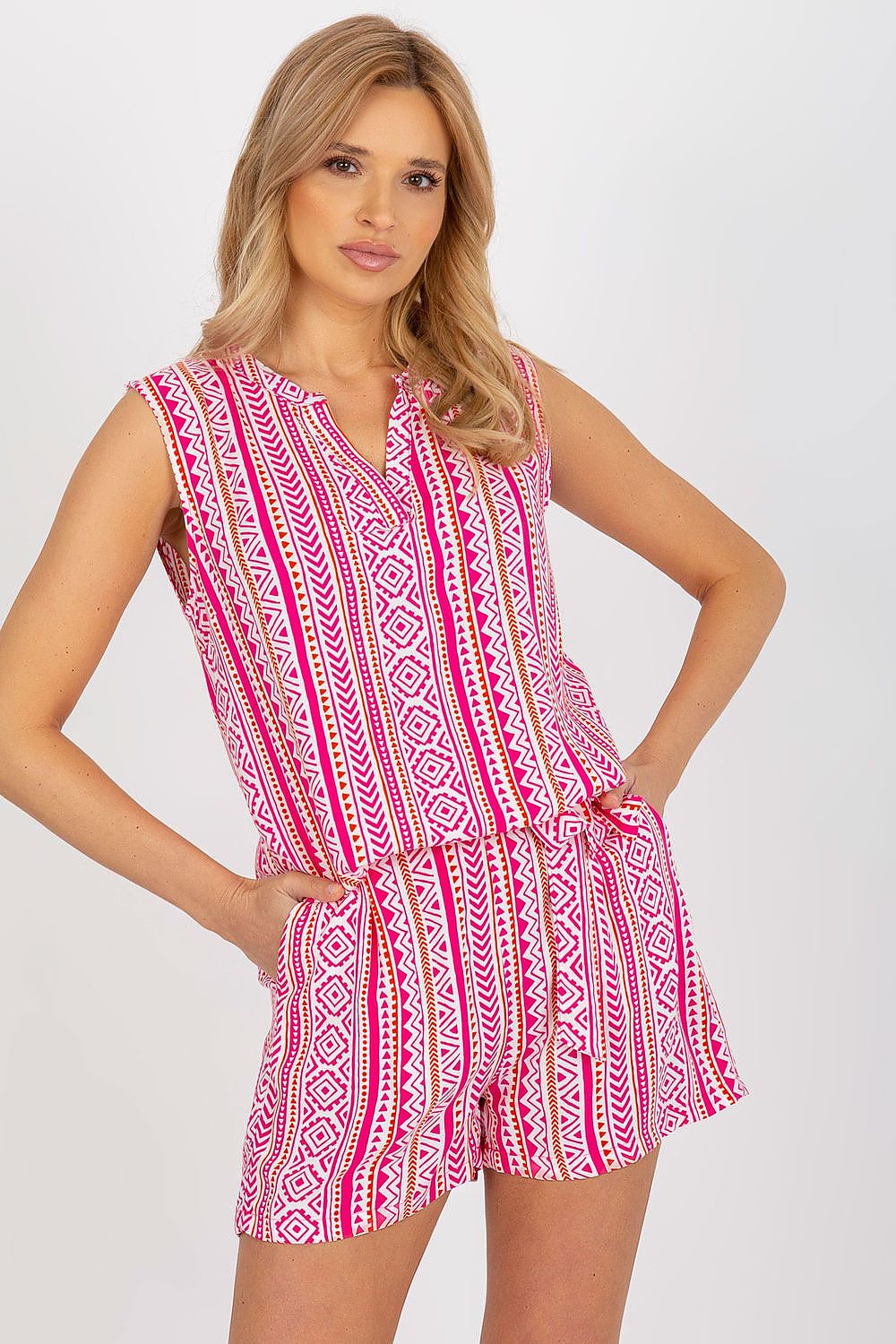Pink and white geometric sleeveless V-neck blouse with gathered waist hem