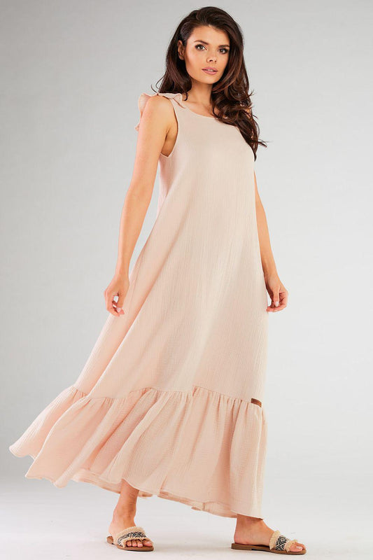 Beige sleeveless day dress with scoop neckline and tiered ruffle hem