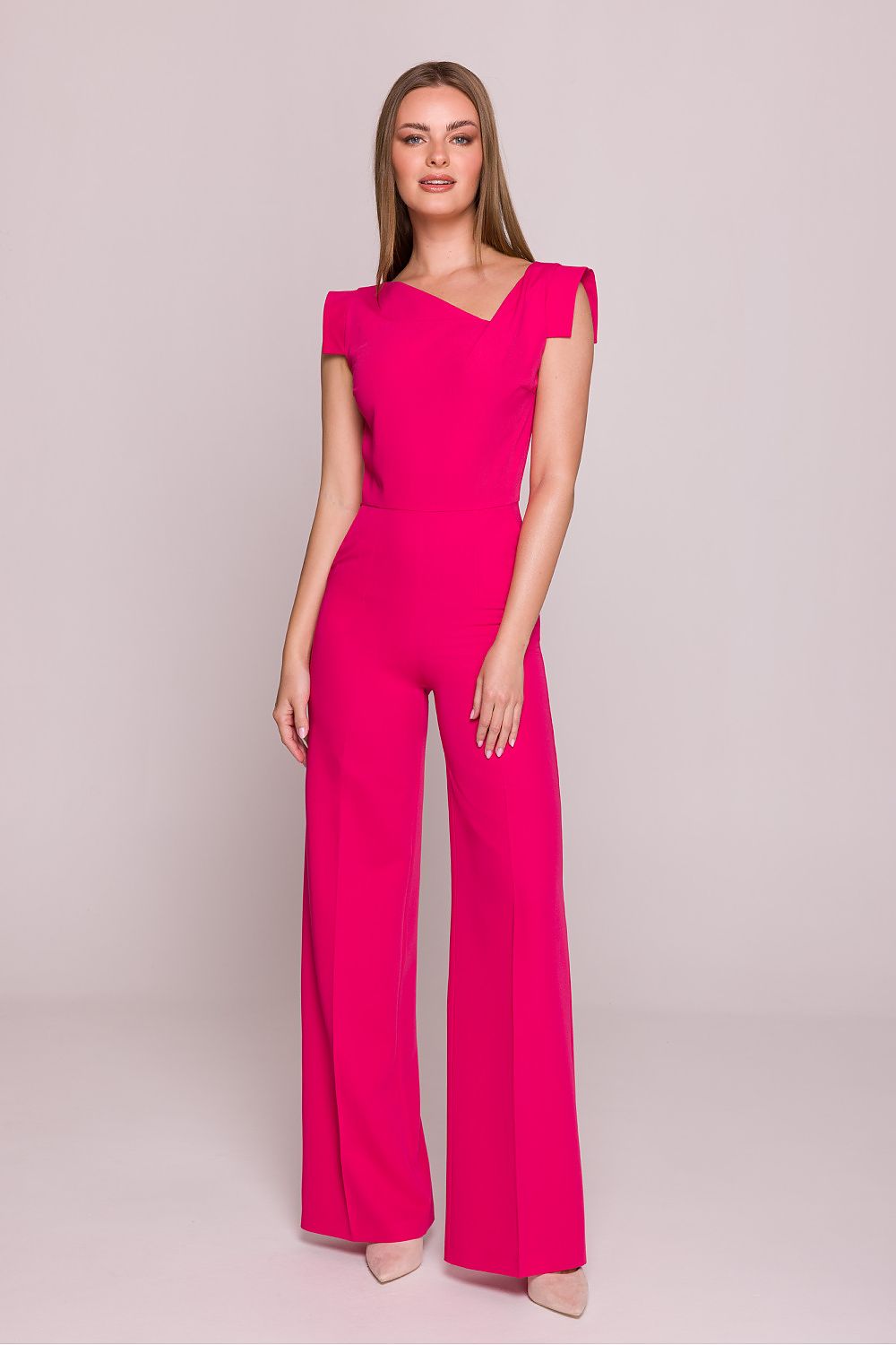 Pink satin jumpsuit with asymmetrical neckline and cap sleeves, full-length wide legs