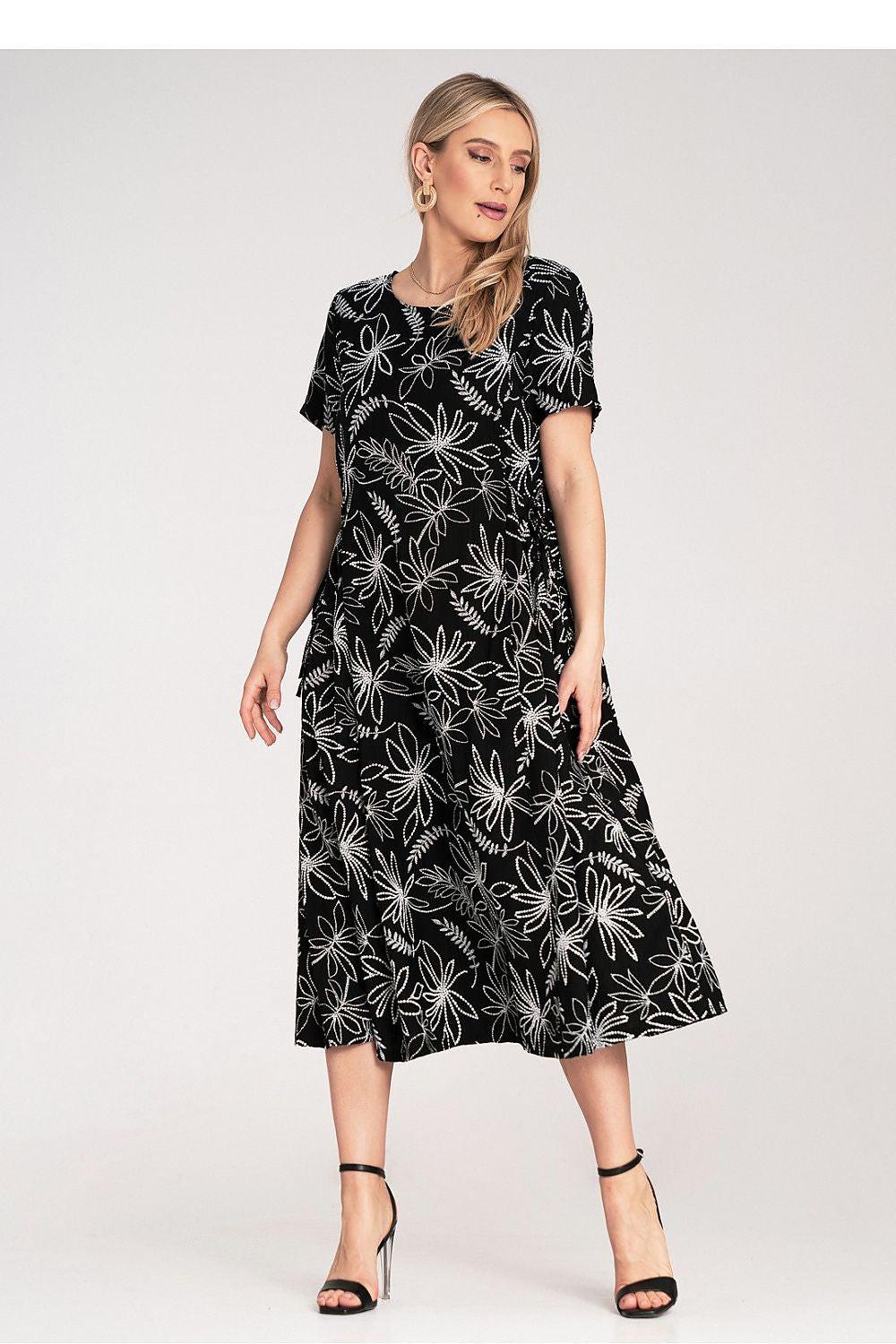 Black midi daydress with white floral print, short sleeves, adjustable waist tie