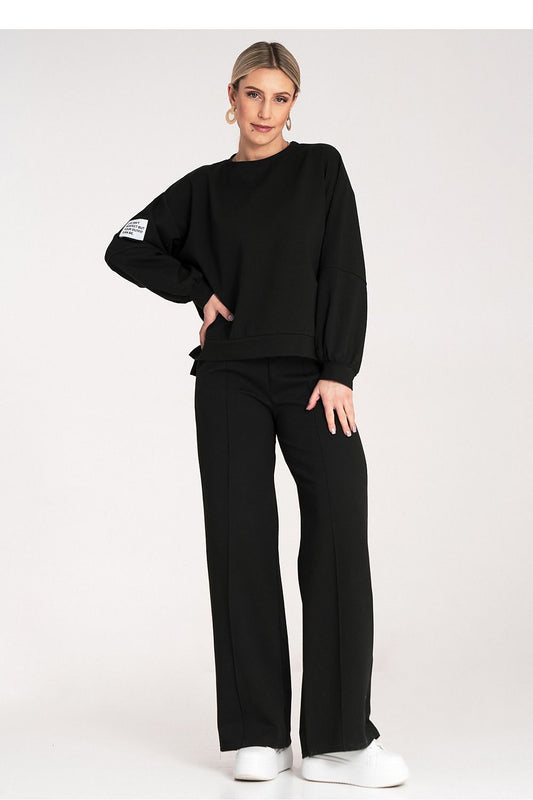 Black tracksuit set with oversized sweatshirt and wide-leg jogger pants