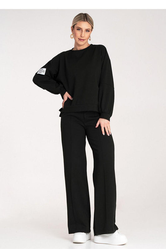 Black two-piece loungewear set with long-sleeve top and wide-leg pants